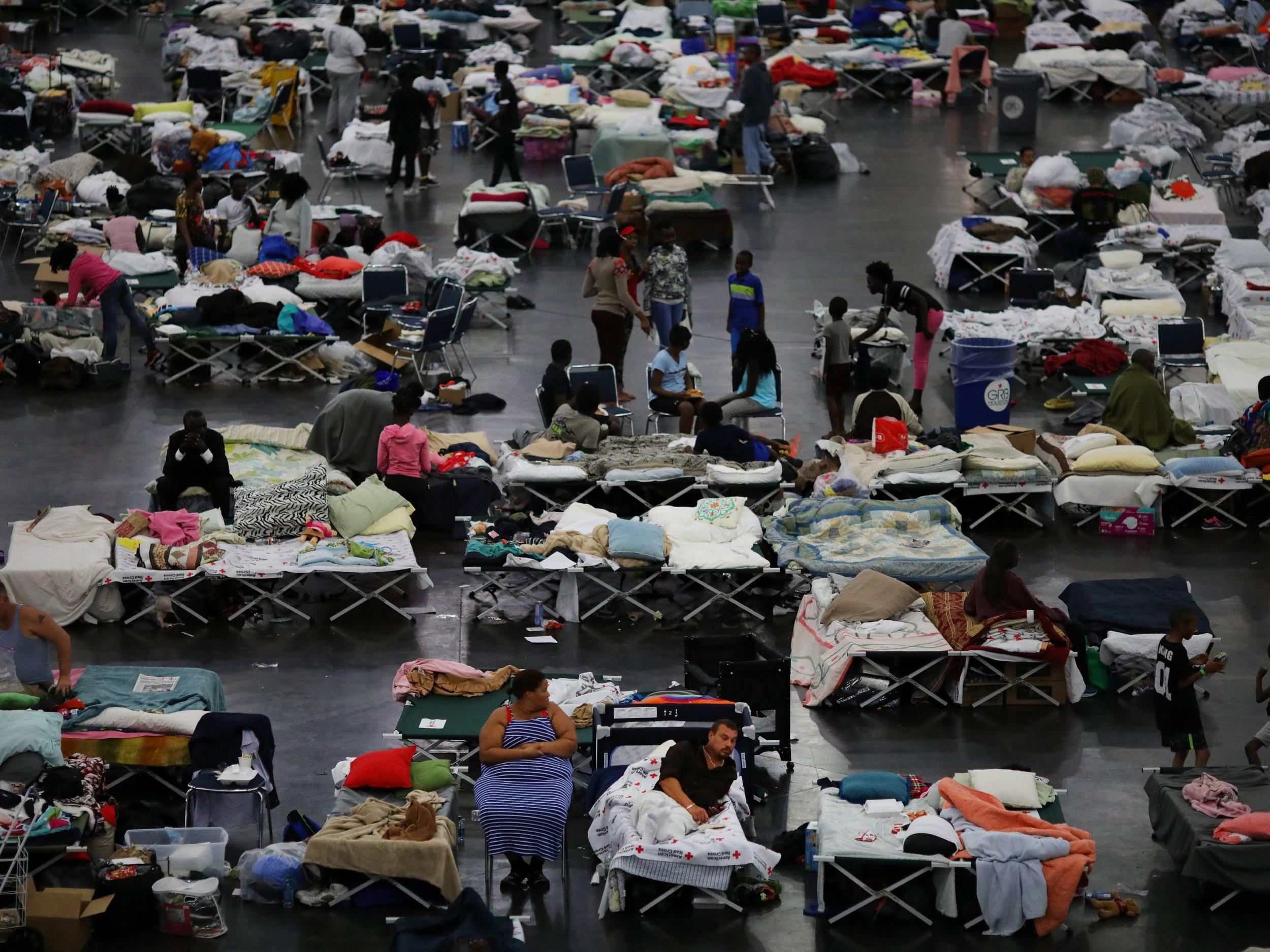 Evacuees affected by Tropical Storm Harvey take shelter at the George R Brown Convention Center in downtown Houston