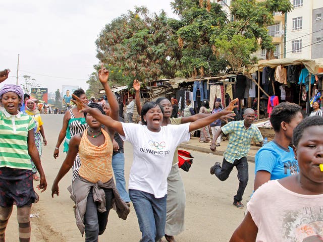 Supporters of opposition leader Raila Odinga celebrate on the streets of Nairobi after hearing the verdict