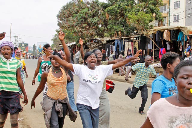 Supporters of opposition leader Raila Odinga celebrate on the streets of Nairobi after hearing the verdict