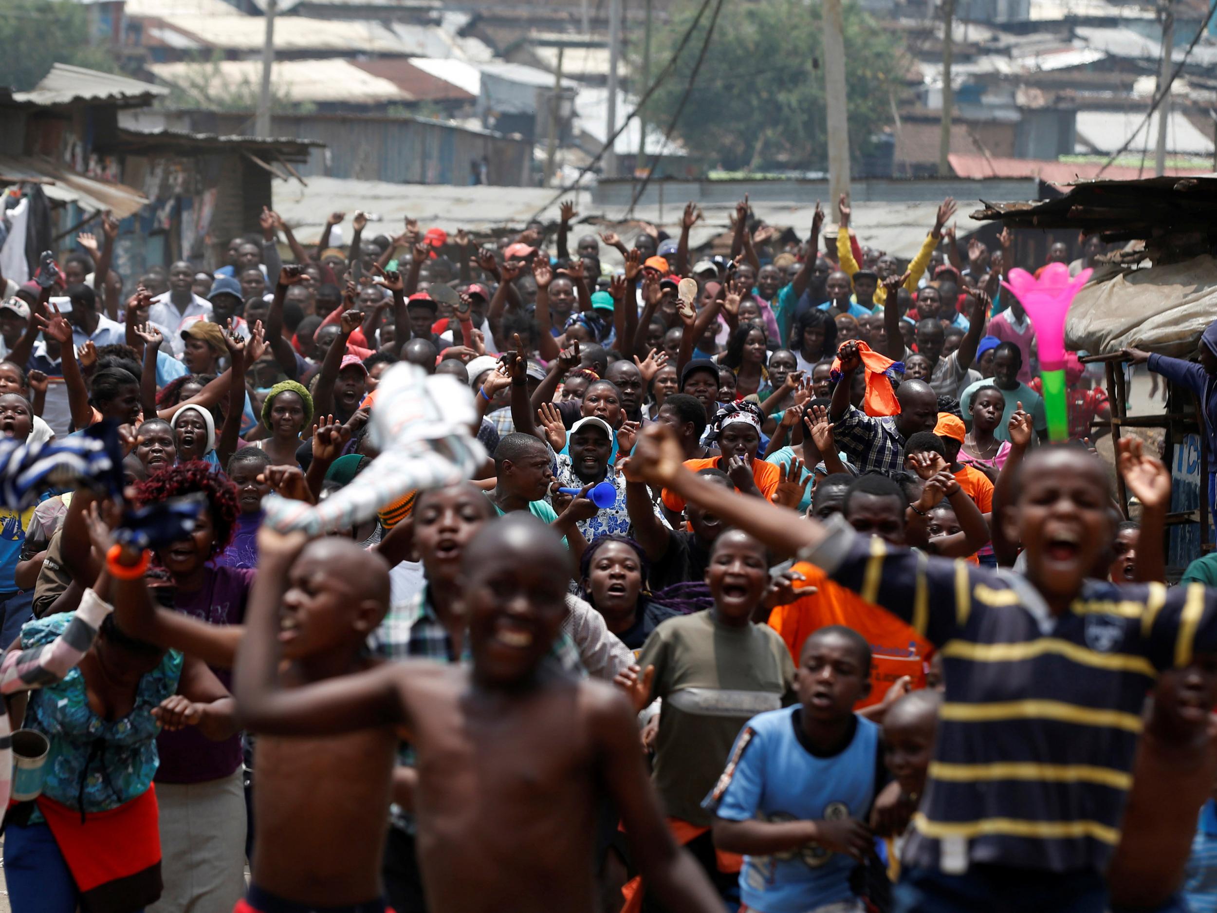 Supporters celebrate in Mathare slum after President Uhuru Kenyatta's election win was declared invalid by a court