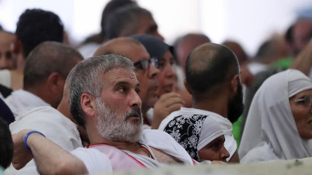 A Muslim pilgrim partakes in the symbolic stoning of the devil at the Jamarat Bridge in Mina, near Mecca, which marks the final major rite of the hajj