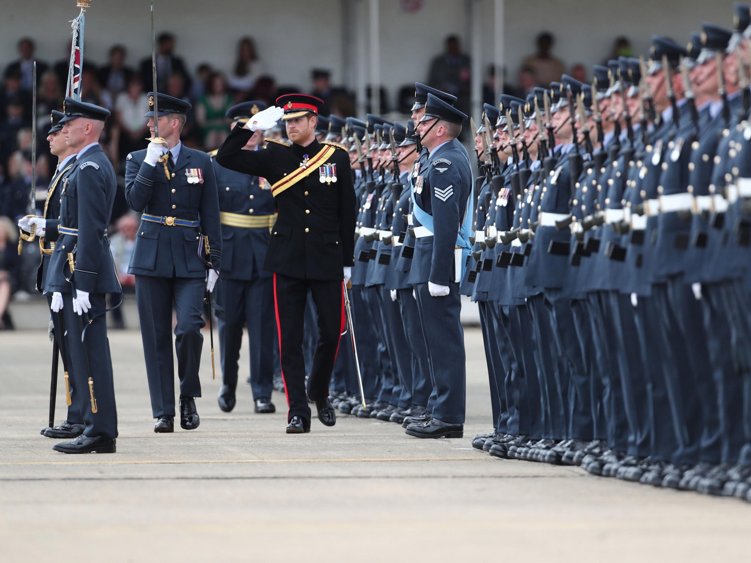 Prince Harry inspects an honour guard at RAF Honington in Suffolk
