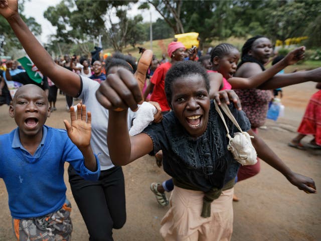 Supporters of opposition leader Raila Odinga celebrate in Uhuru Park, Nairobi, after hearing the verdict
