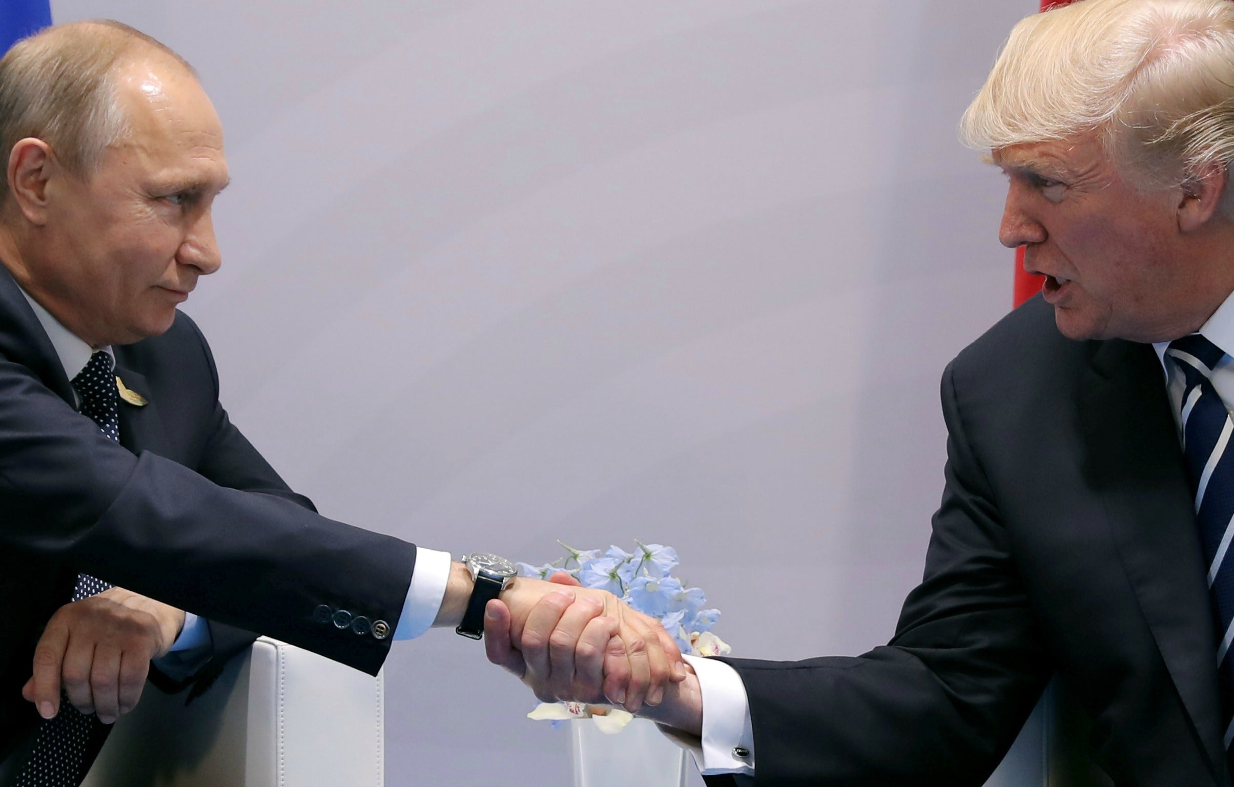 President Donald Trump shakes hands with Russian President Vladimir Putin during the their bilateral meeting.