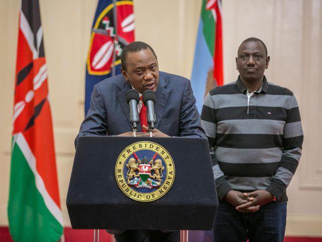 Kenya's President Uhuru Kenyatta, flanked by his Deputy William Ruto, addresses the nation on the day his election victory was cancelled by Supreme Court Judges