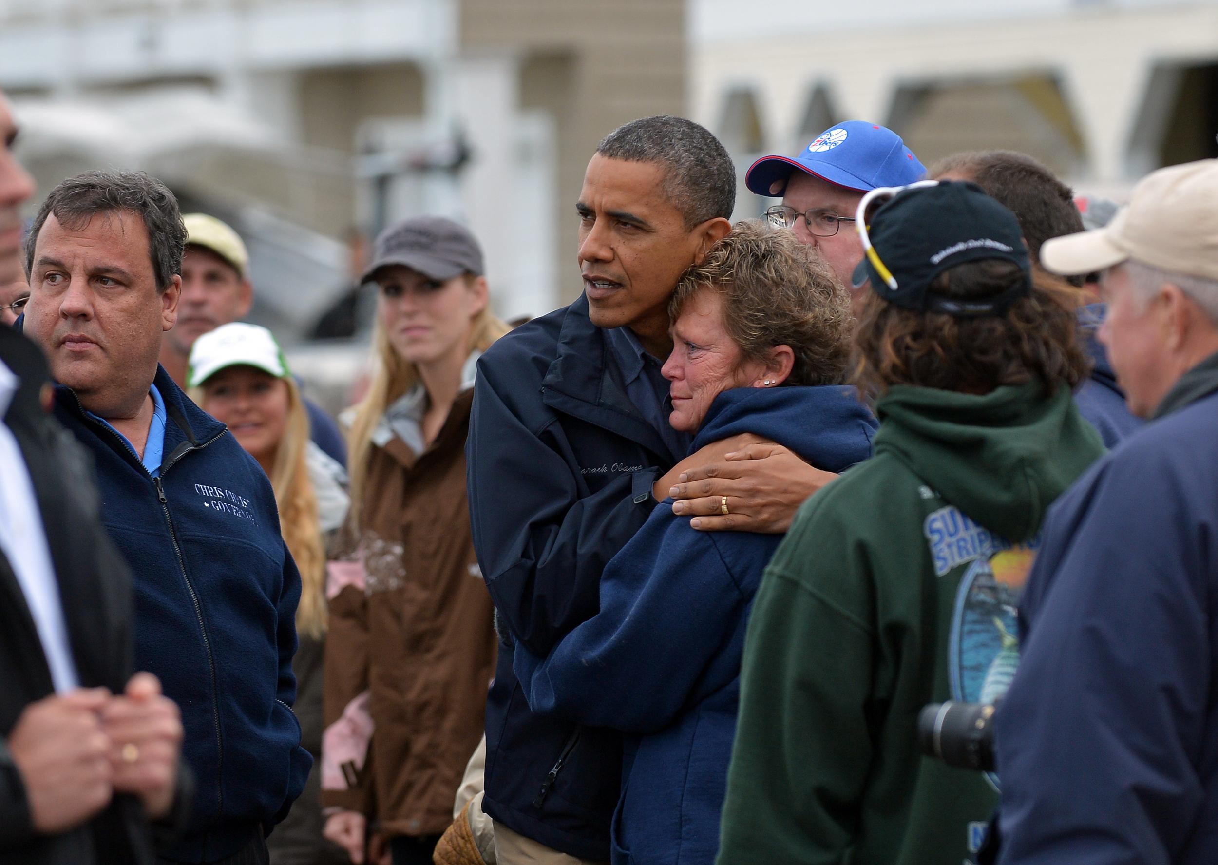 US President Barack Obama comforts Hurricane Sandy victim Dana Vanzant during a visit to New Jersey in October 2012