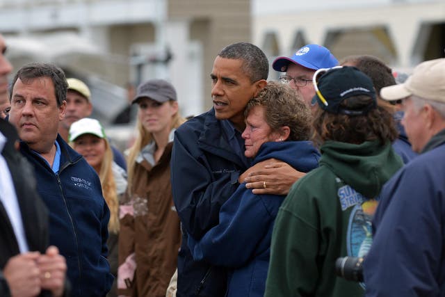 US President Barack Obama comforts Hurricane Sandy victim Dana Vanzant during a visit to New Jersey in October 2012