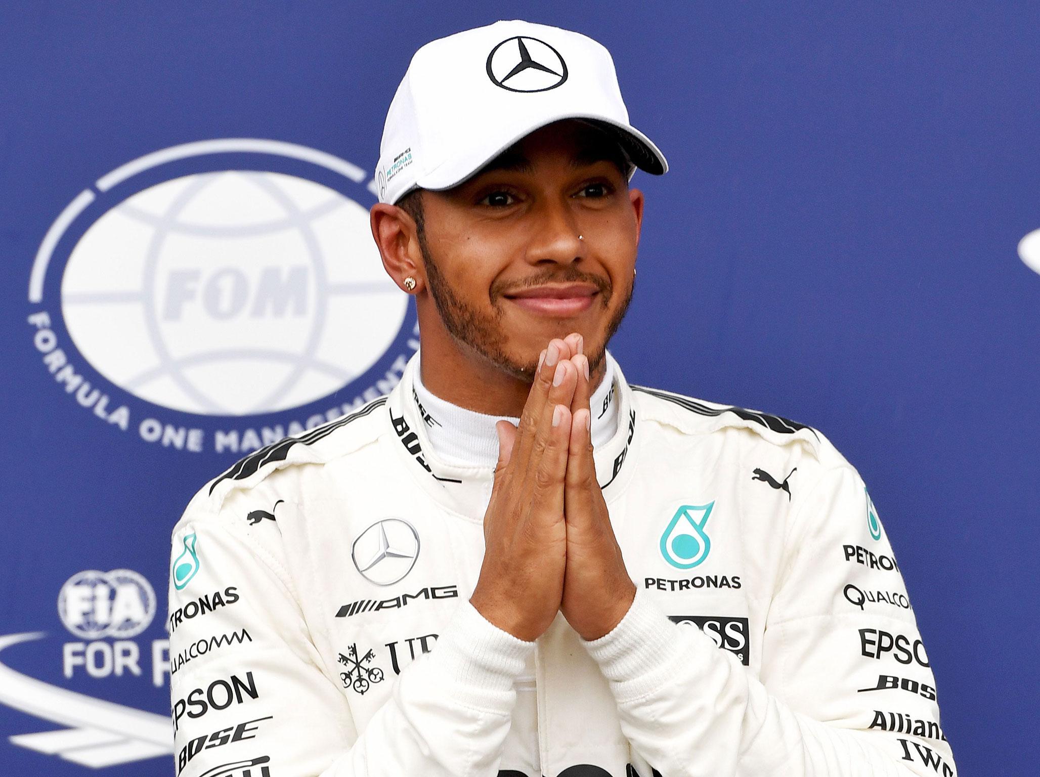 Lewis Hamilton put on a masterclass of wet-weather driving to top the timesheets at Monza