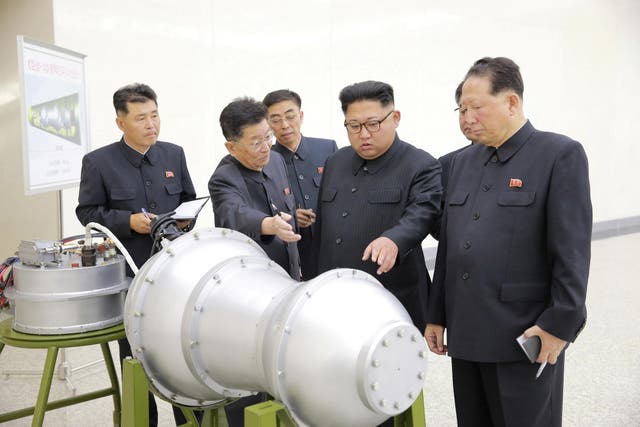 Kim Jong Un inspects what is said to be a new nuclear weapon