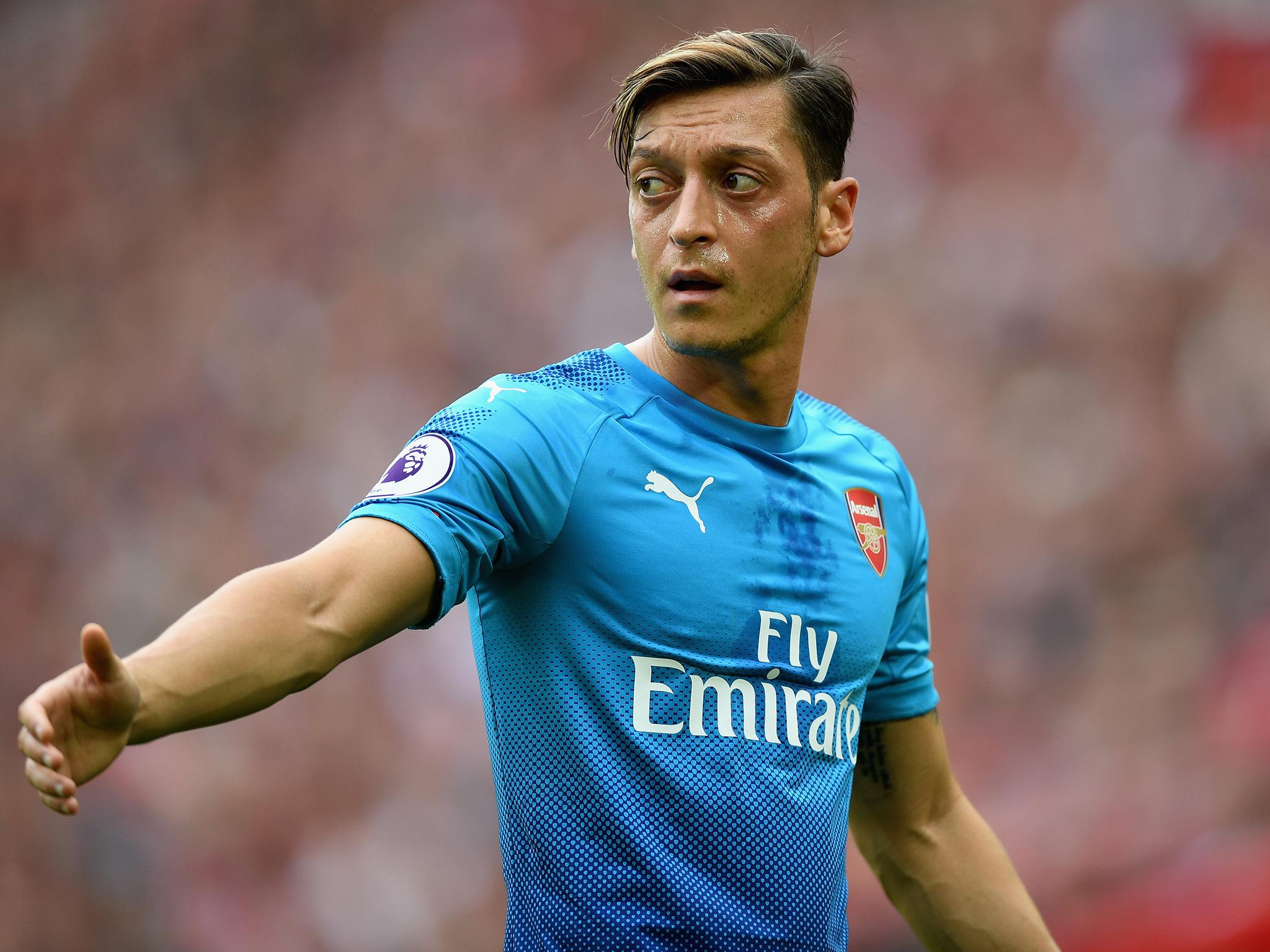 Ian Wright questioned why Mesut Ozil has not signed a new Arsenal contract
