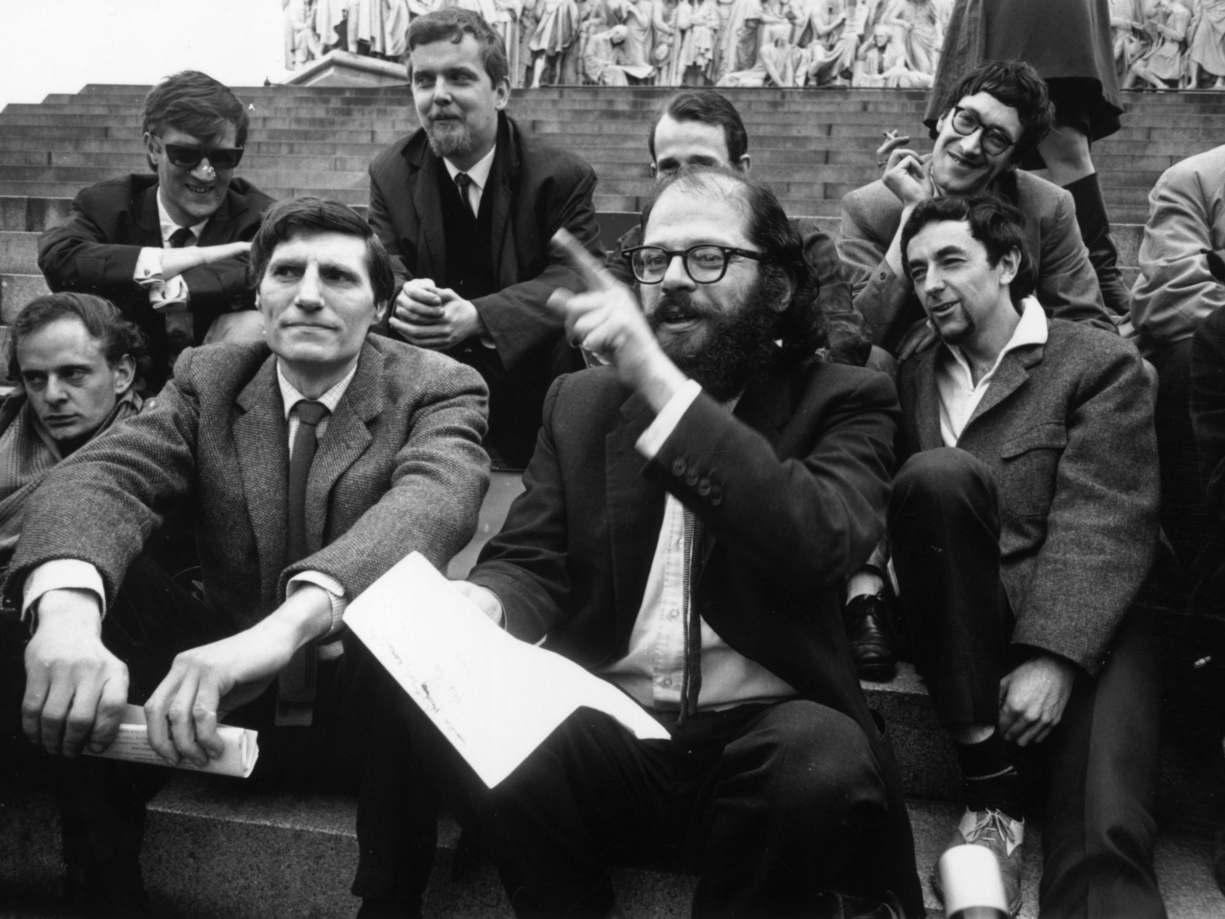 Beat poet Allen Ginsberg, front, in 1965