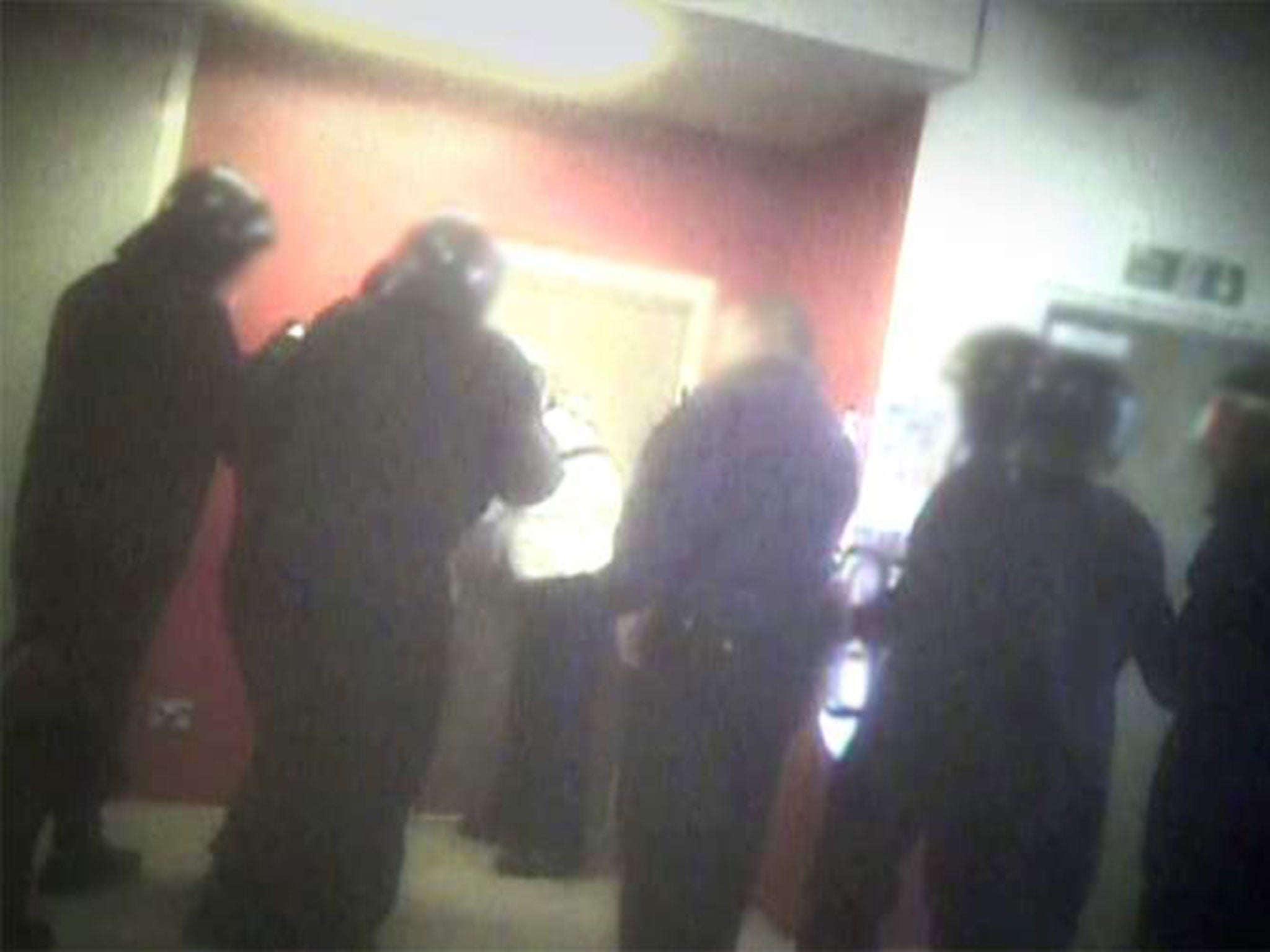 Riot officers preparing to enter a room in G4S-run Brook House immigration detention centre