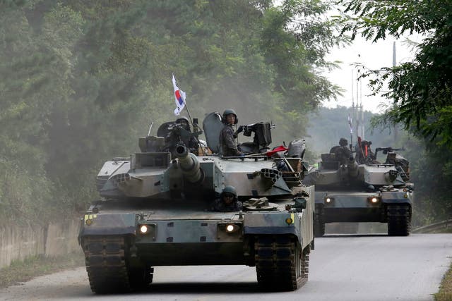 South Korean army K-1 tanks move during a military exercise in Paju, South Korea, near the border with North Korea