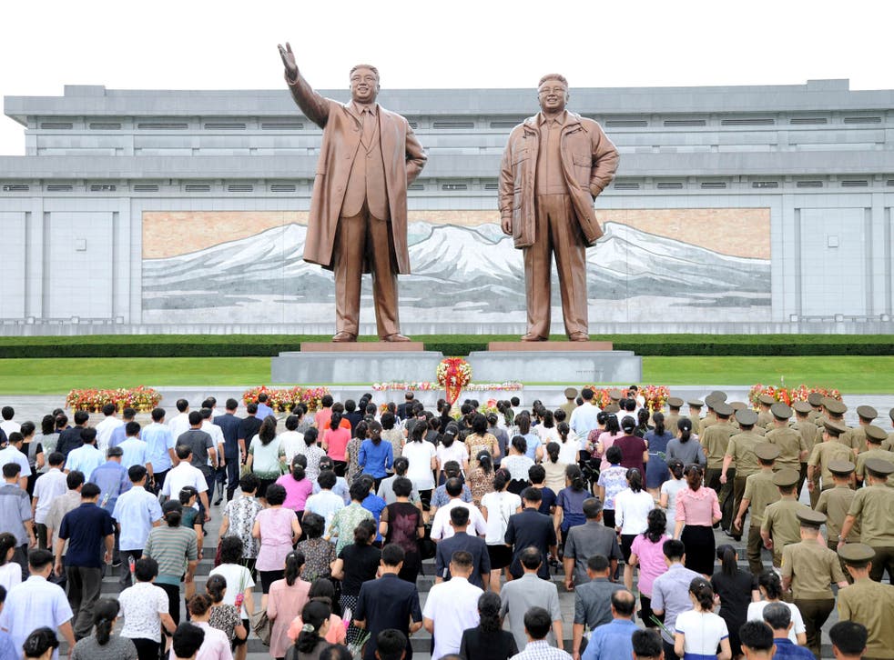 Servicepersons of the Korean People's Army and the Korean People's Internal Security Forces, civilians, school youth and children visit the statues of President Kim Il Sung and leader Kim Jong Il