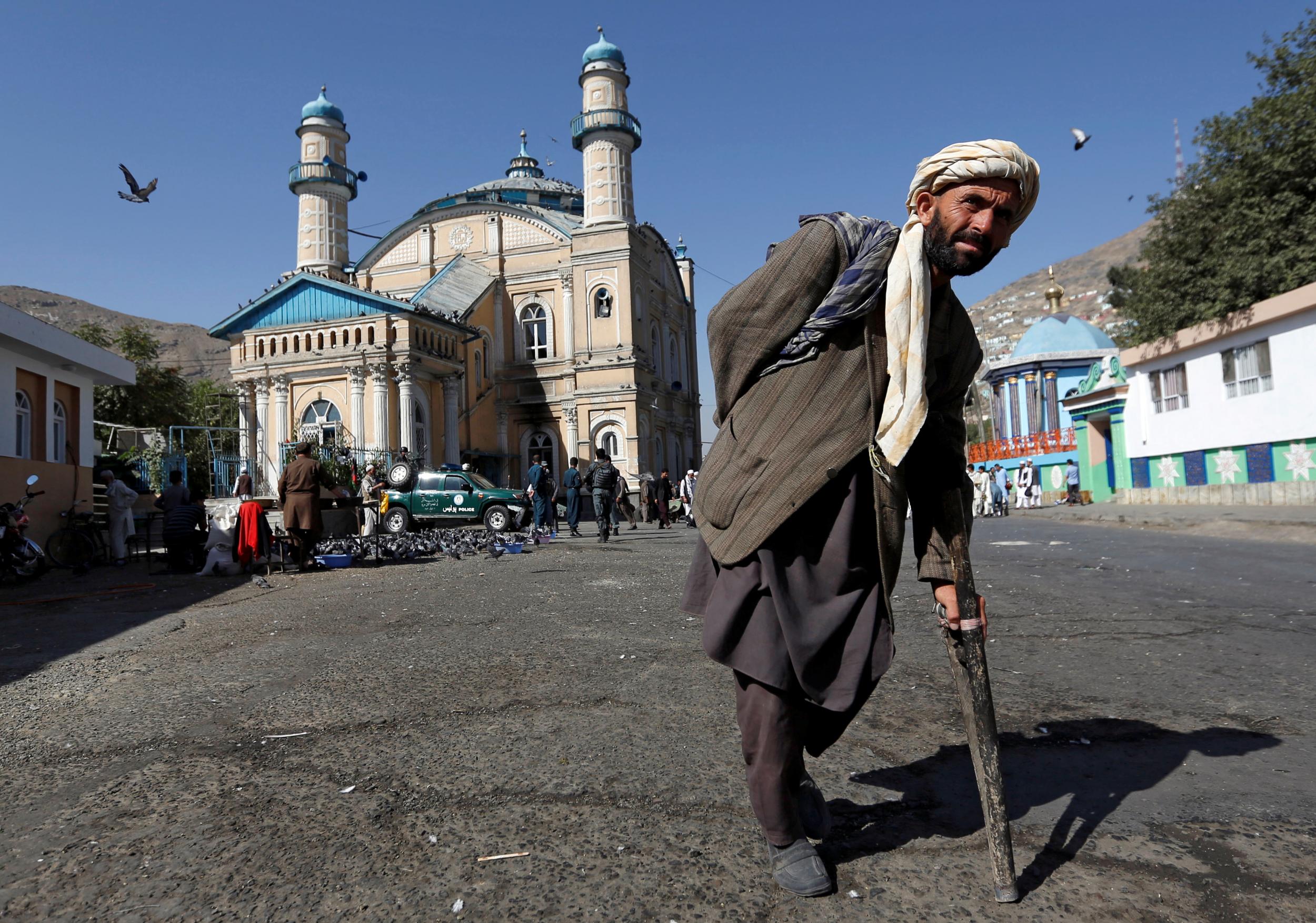 An Afghan man leaves after morning prayers to celebrate the first day of the Muslim holiday of the Eid al-Adha in Kabul