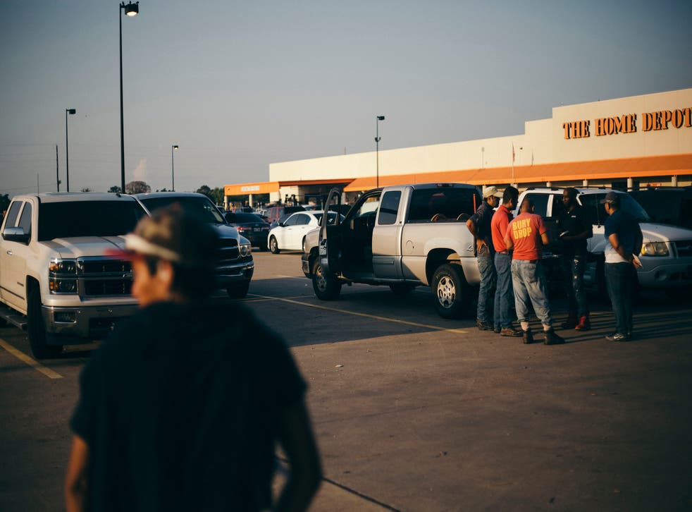 Illegal labourers seek work in a Home Depot car park in southwestern Houston. There has been a huge spike in demand for manual workers after hurricanes Harvey and Irma battered the states of Texas and Florida
