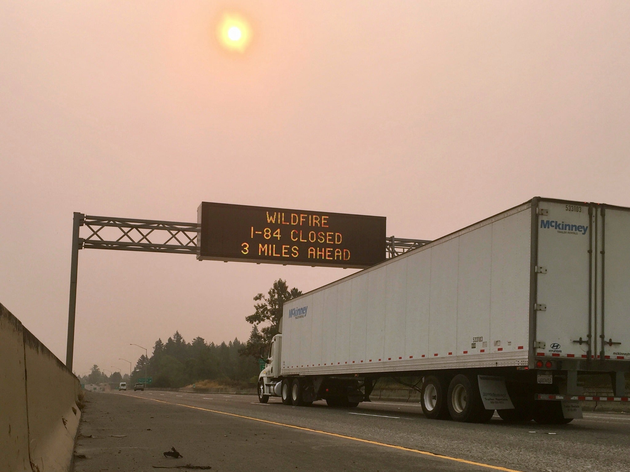 A sign warns of a highway closure in Troutdale, Oregon on Tuesday, Sept. 5, 2017, as fires blazed across the Western United States.