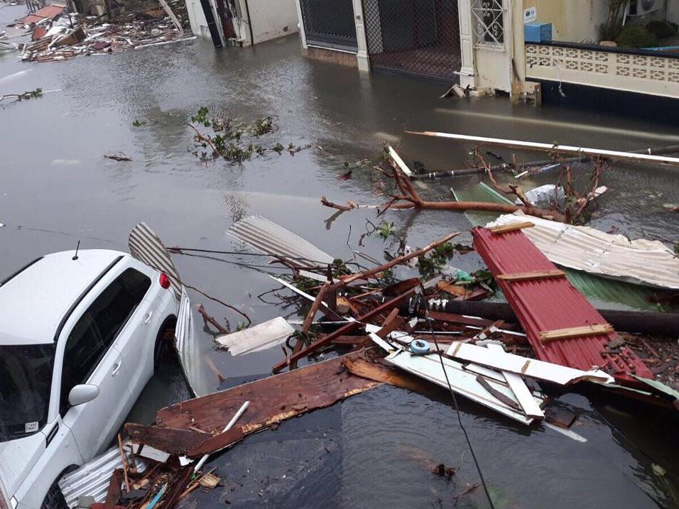 Debris lies in a flooded street in Saint Martin