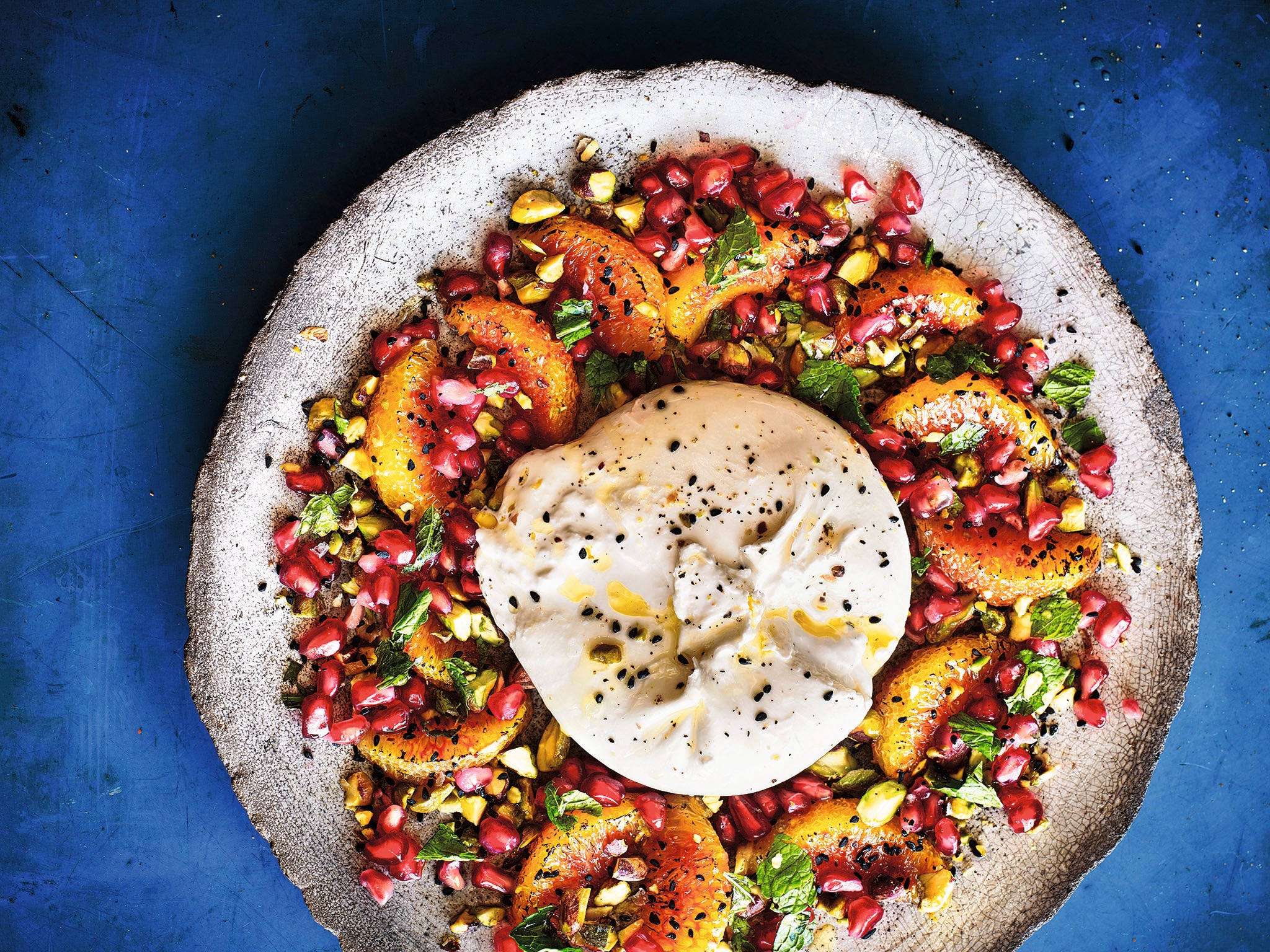 Crowned jewels: pistachios, pomegranate and nigella seeds with burnt oranges, topped with burrata cheese