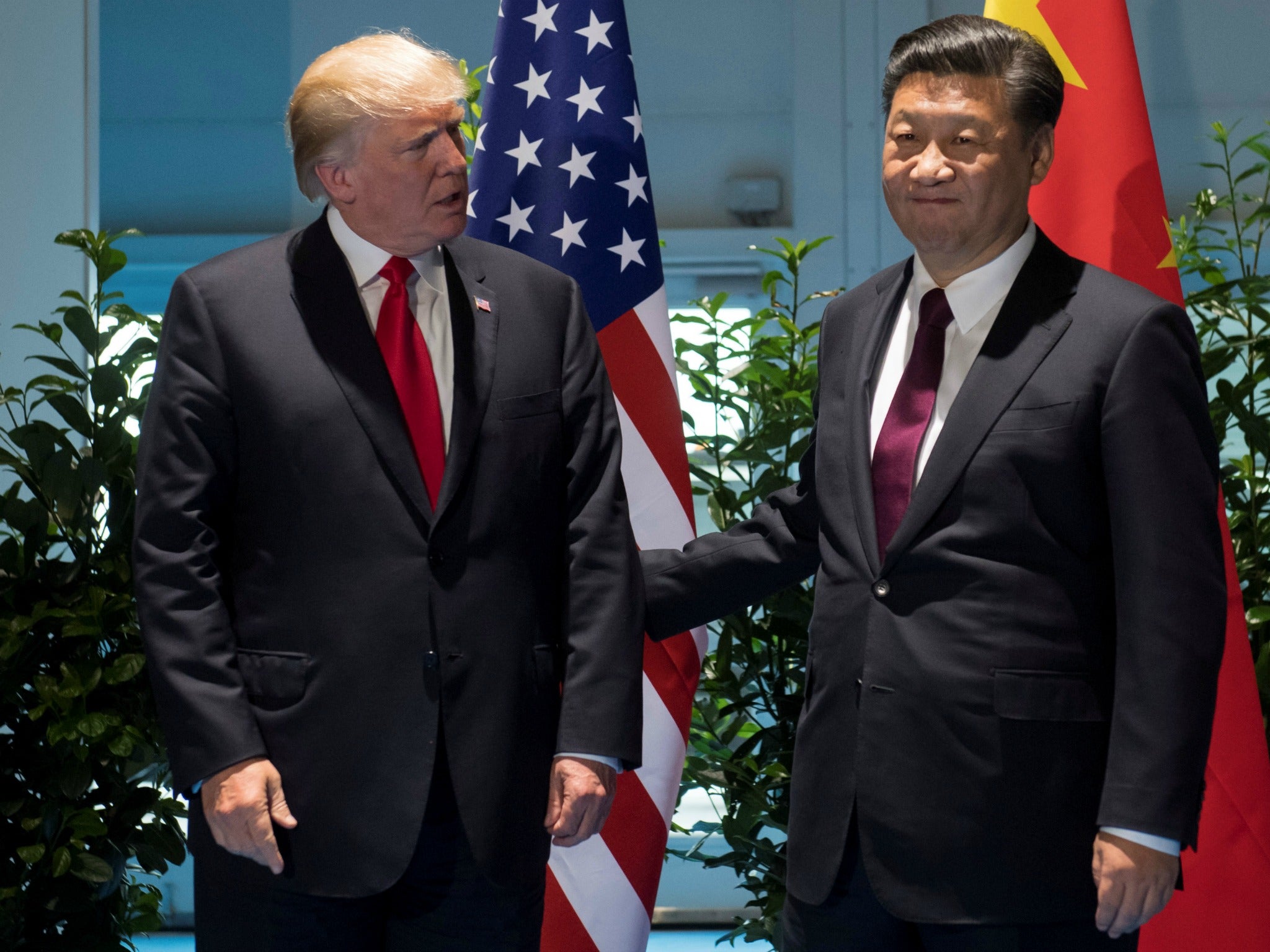 U.S. President Donald Trump and Chinese President Xi Jinping, seen here at the G20 Summit in Hamburg, Germany on July 8, 2017, discussed options for containing the North Korean threat