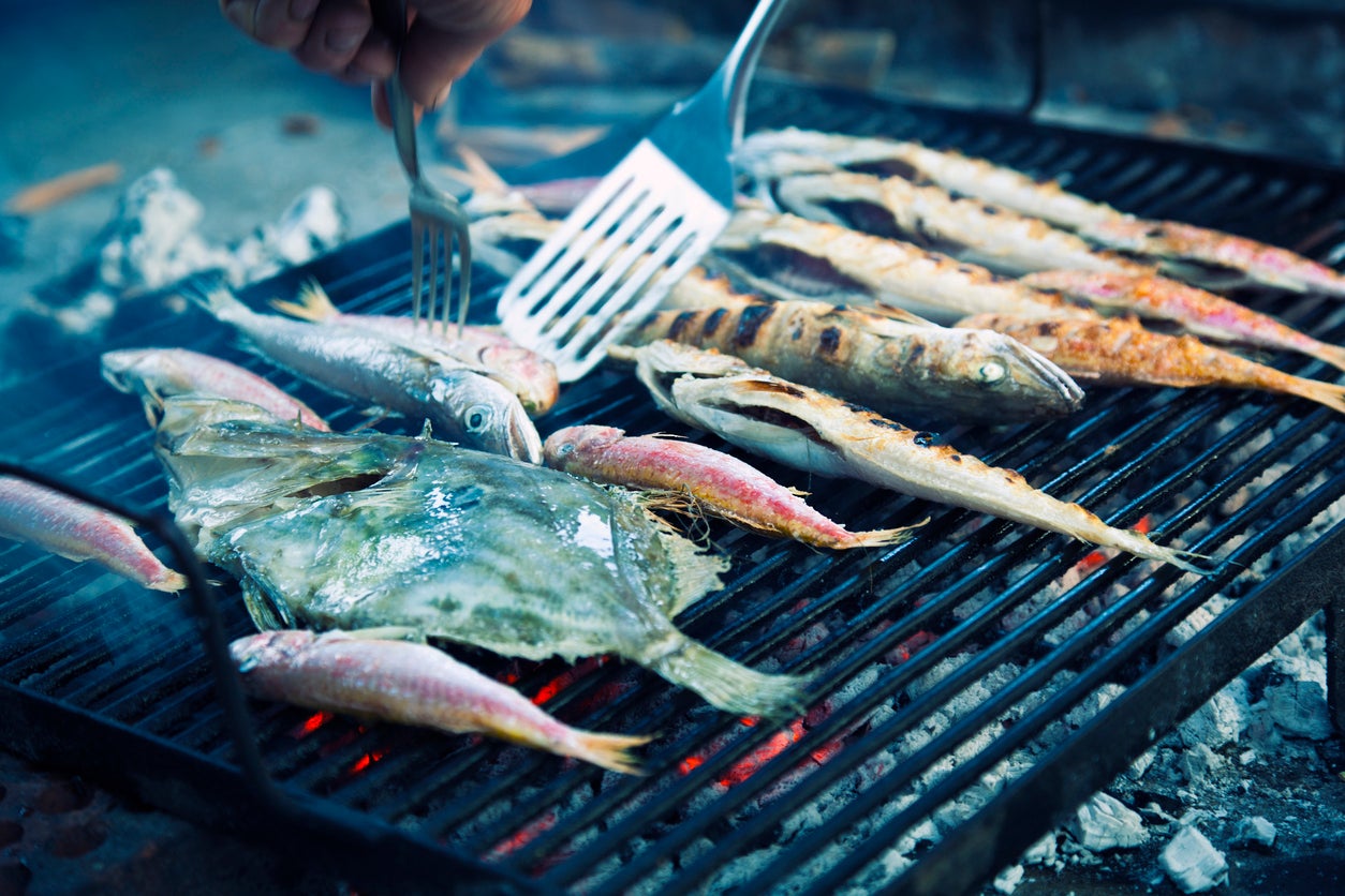 Enjoy barbecued fish on the beach (Getty/iStockphoto)