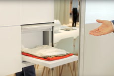 Prototype washing machine has robot arms that fold clean clothes