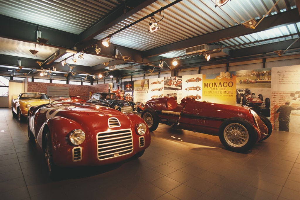 The 1947 Ferrari 125 S, left, beside 1935 Alfa Romeo Monoposto (Getty)