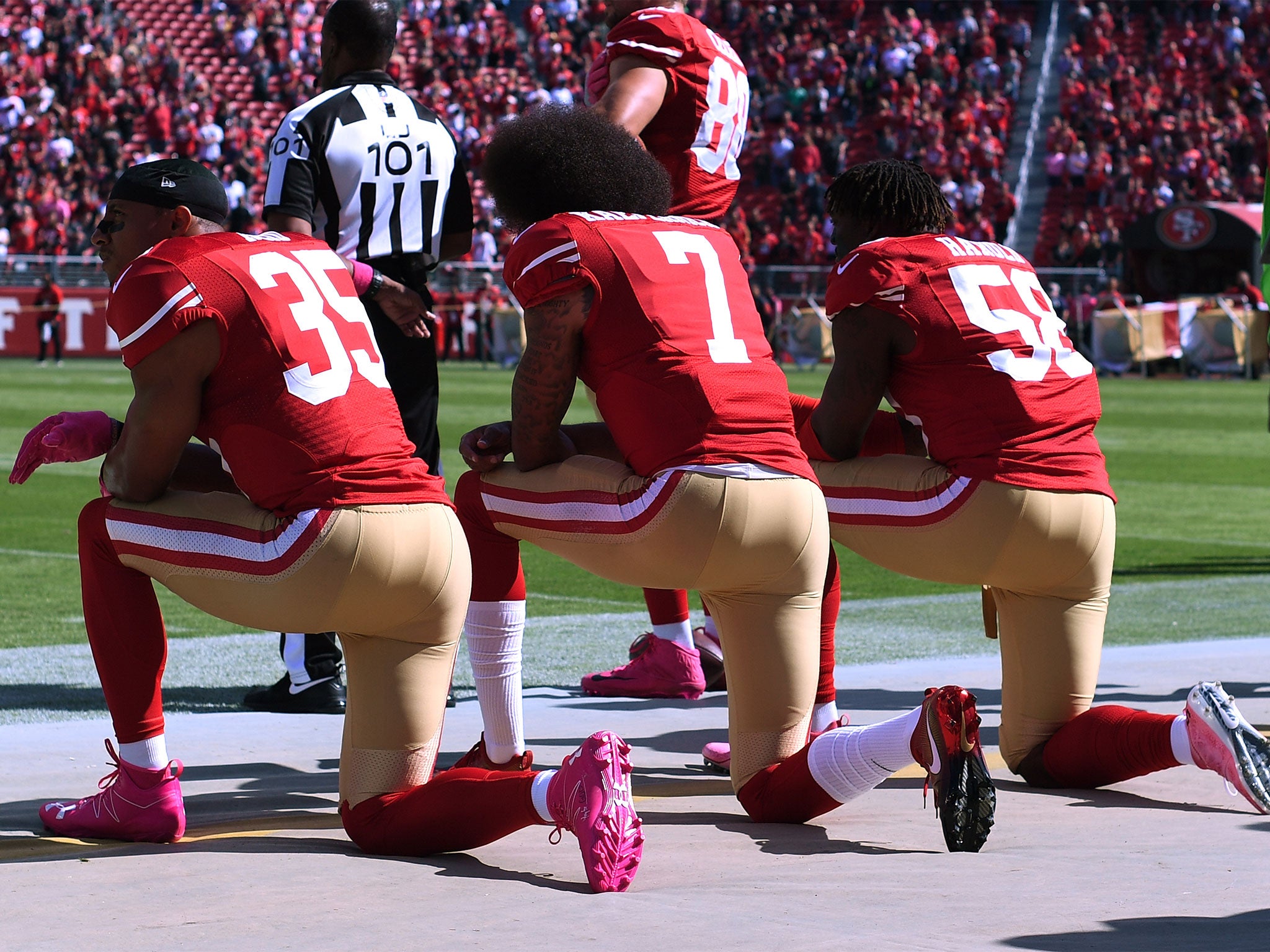Colin Kaepernick kneels for the American national anthem in 2016