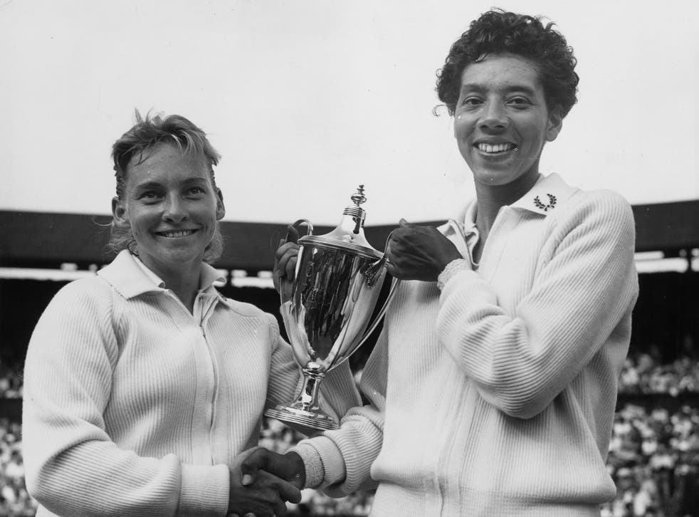 Althea Gibson and Darlene Hard with the women's doubles trophy at the Wimbledon Lawn Tennis Championships, July 1957