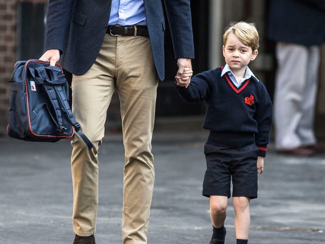 Prince George arrived for his first day at primary school, accompanied by his father
