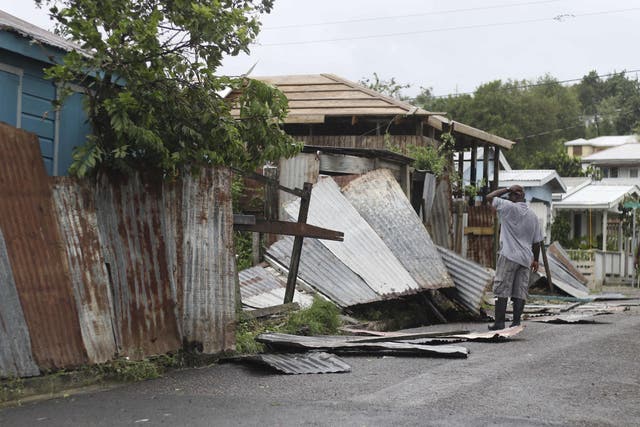 A man surveys the wreckage to his property after the passing of Hurricane Irma, in St John's, Antigua and Barbuda