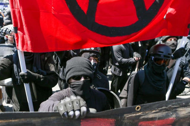Antifa activists dress in their distinctive all-black attire during a rally in Berkeley, California