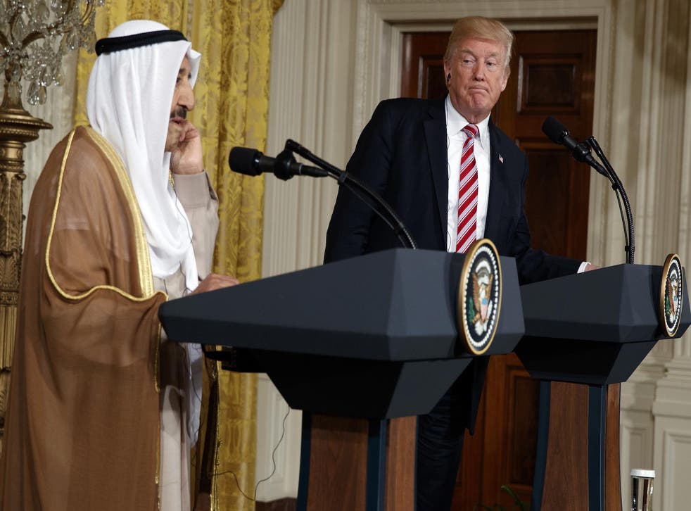 President Donald Trump listens as Emir of Kuwait Sheikh Sabah Al Ahmad Al Sabah speaks during a news conference in the East Room of the White House