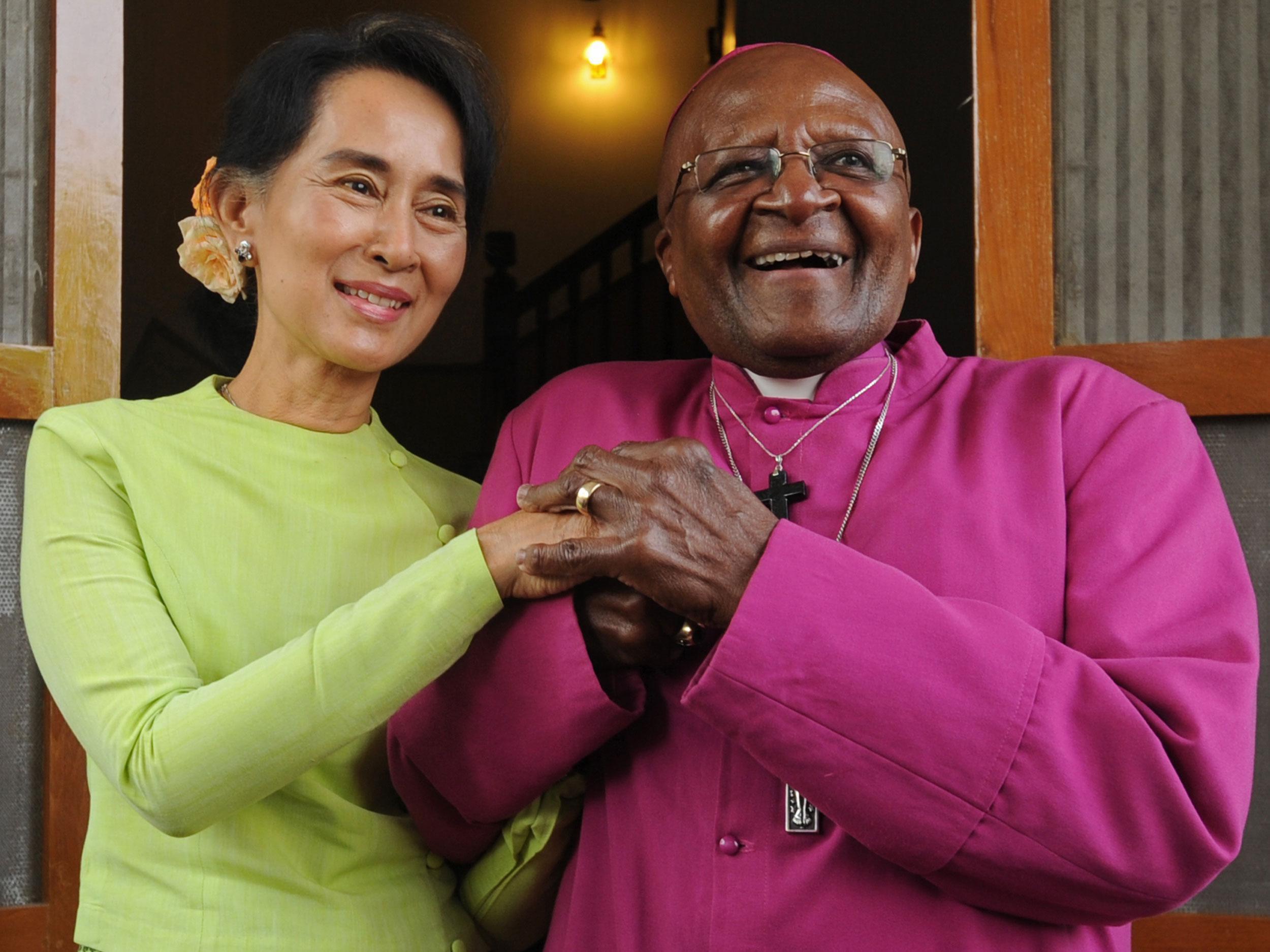 Ms Suu Kyi, pictured with Mr Tutu in Burma in 2013, also faces pressure from Malala Yusafzai over the plight of the Rohingya people