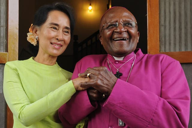 Ms Suu Kyi, pictured with Mr Tutu in Burma in 2013, also faces pressure from Malala Yusafzai over the plight of the Rohingya people
