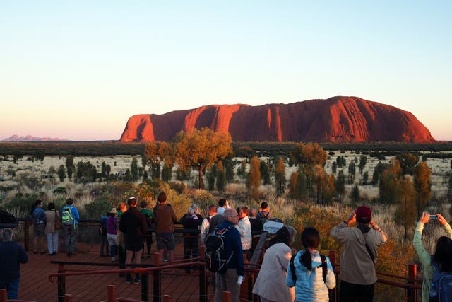 Tourists clamour to capture the perfect Uluru sunset shot