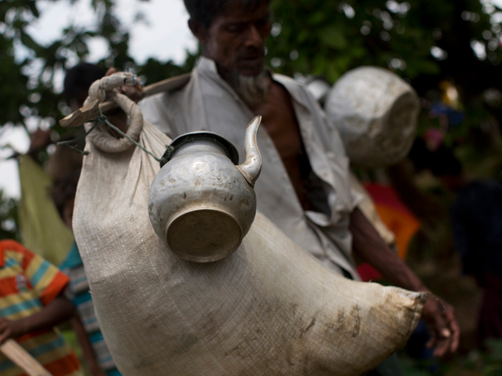 Rohingya Muslims, fled from ongoing military operations in Burma's Rakhine state, try to take food aid at a refugee camp 50 kilometres south of Cox's Bazar, Bangladesh