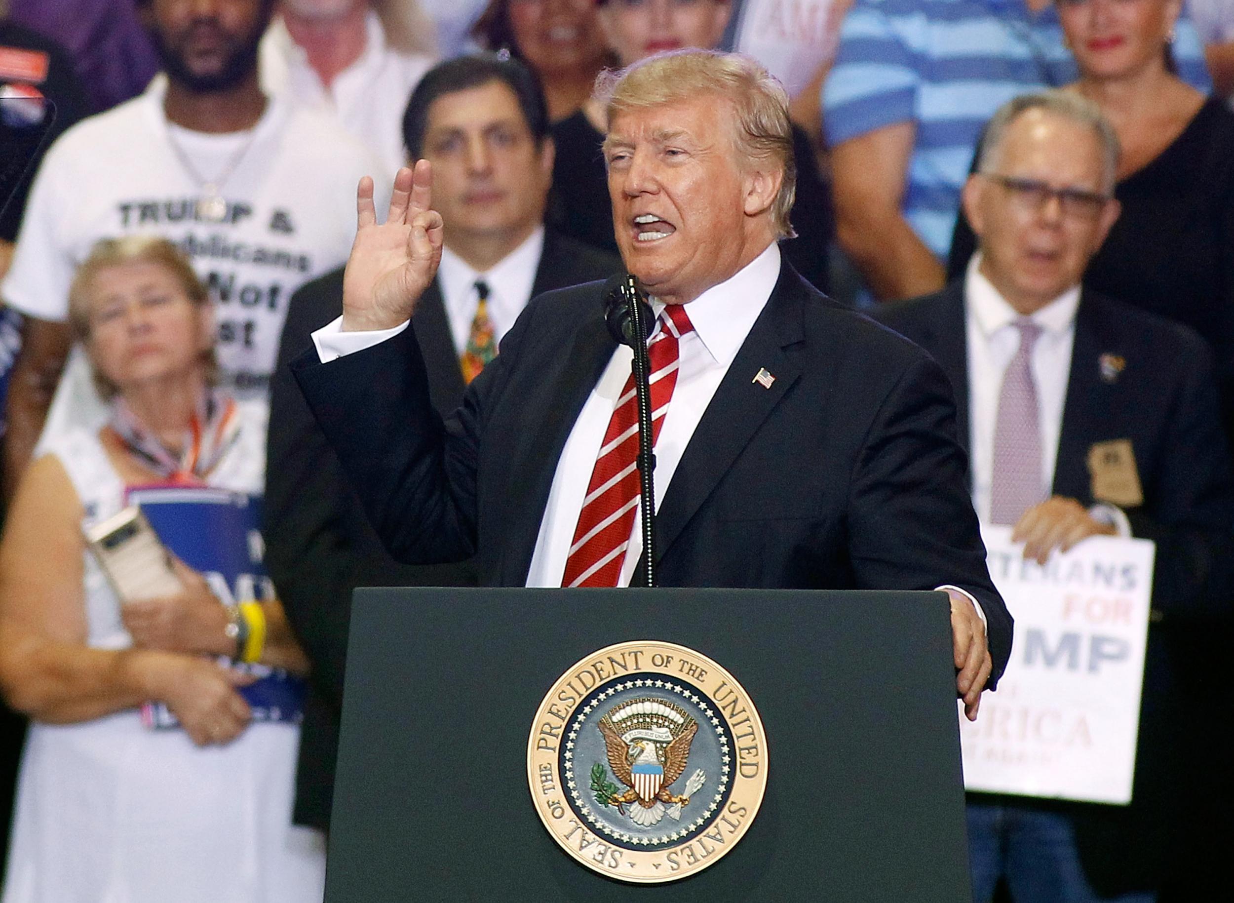 President Donald Trump speaks to a crowd of supporters at the Phoenix Convention Center during a rally