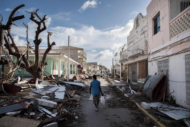 A man walks on a street covered in debris after hurricane Irma hurricane passed on the French island of Saint-Martin