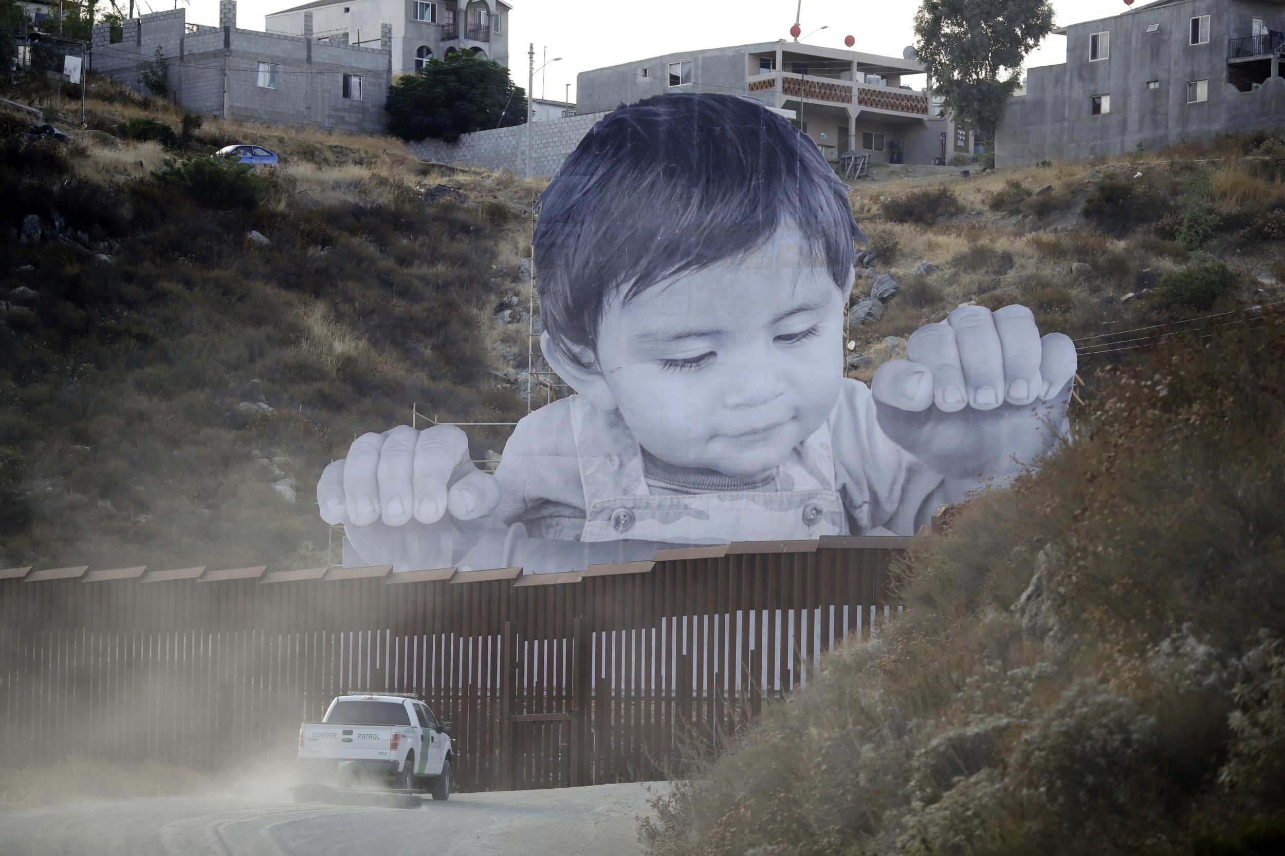 Artist JR, whose artwork comes as Trump scrapped Daca, hopes his image will spark immigration conversations