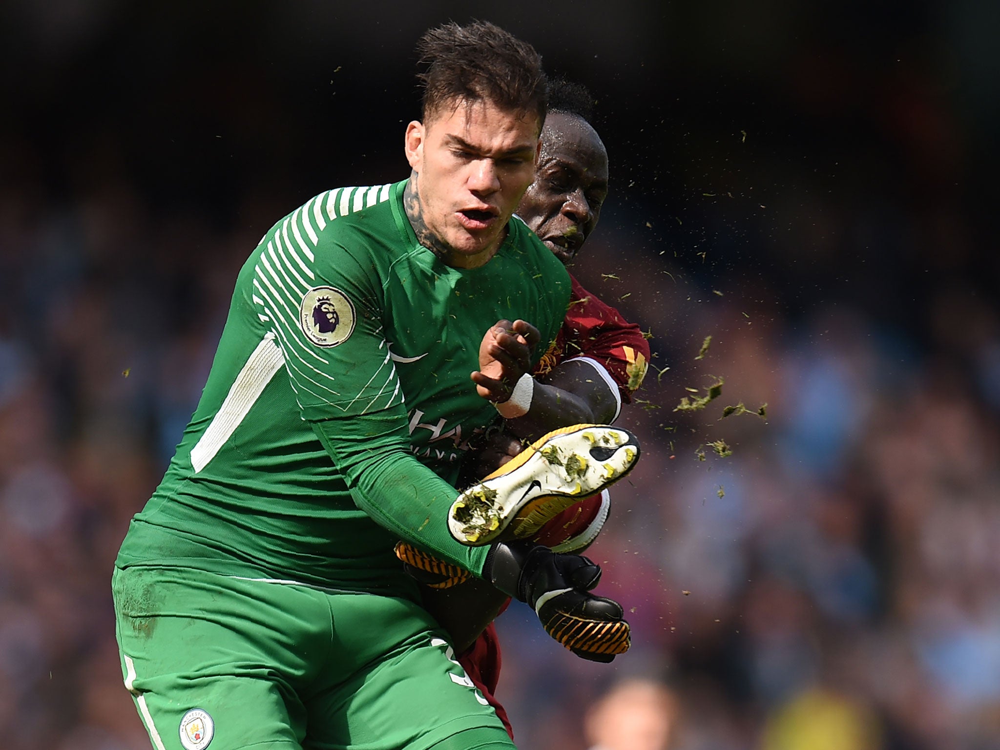 Ederson was caught in the face by a high foot from Sadio Mane