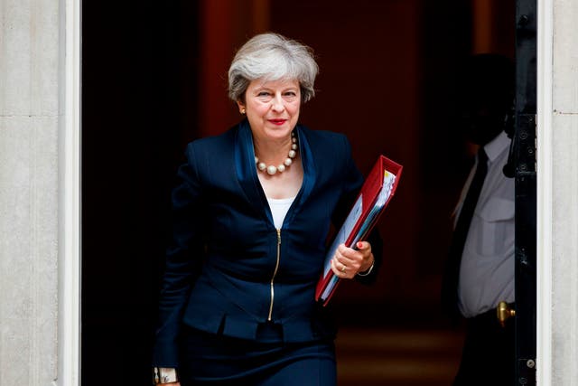 Theresa May leaves Downing Street