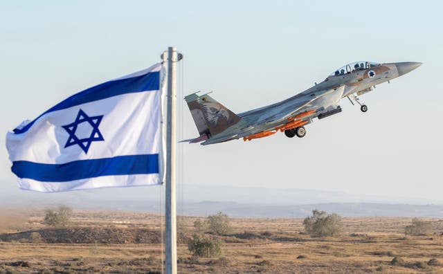 An Israeli Air Force F-15 Eagle fighter plane performs at an air show