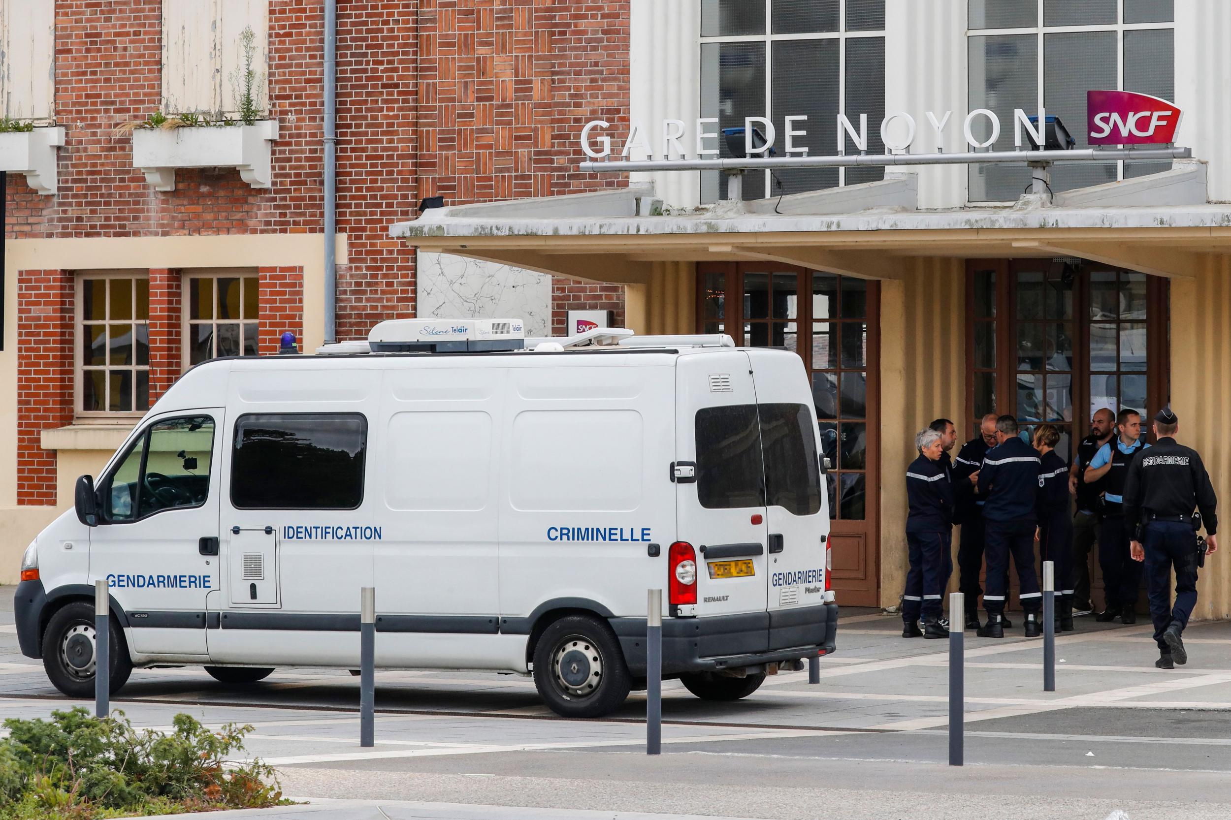 Gendarmes gather by a forensic police van outside the railway sation in Noyon, northeast of Paris FRANCOIS GUILLOT/AFP/Getty Images