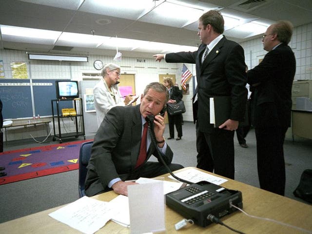 President George Bush on the telephone as the second plane hit the Twin Towers in New York
