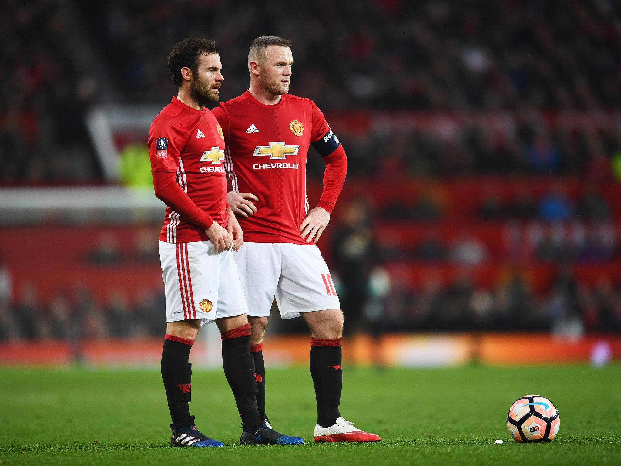 Juan Mata and Wayne Rooney during their time together at United