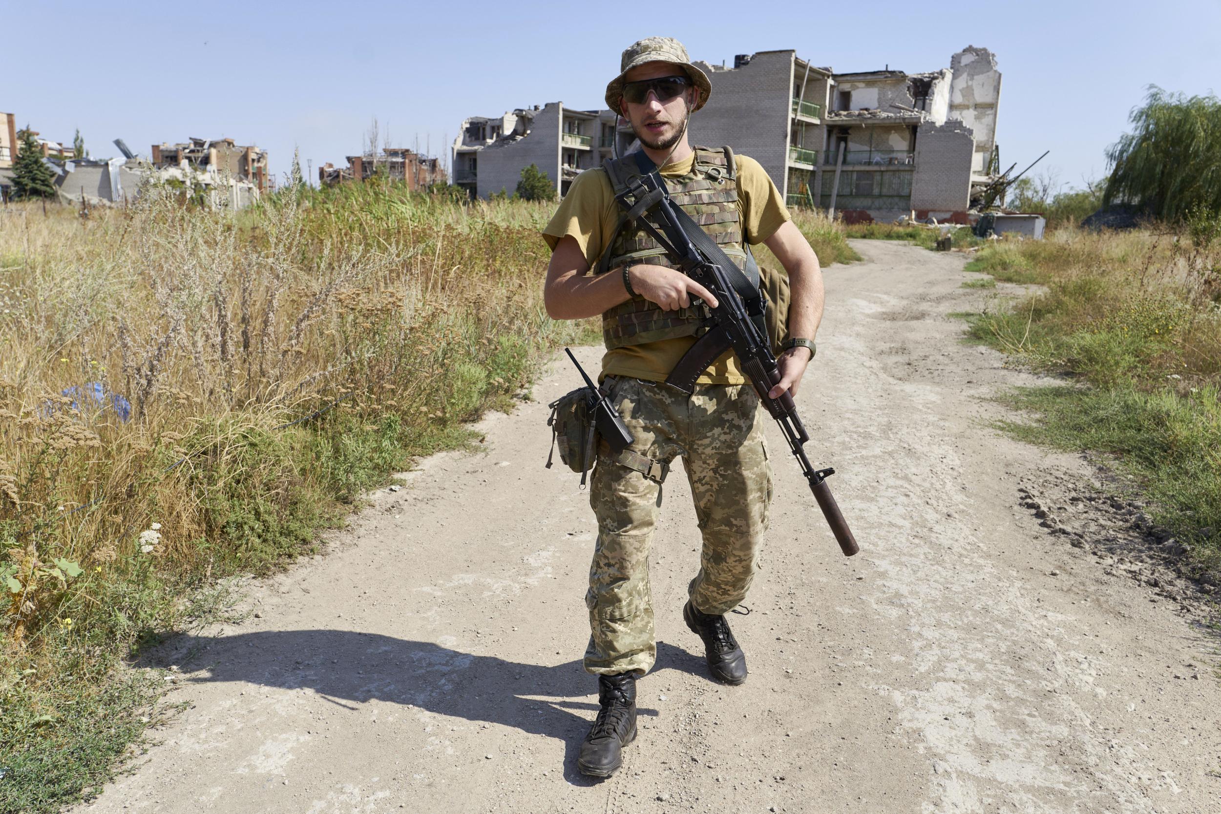 A Ukrainian soldier in the village of Shyrokyne, within the war zone, on Saturday: troops are currently preparing for fresh battles