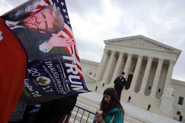 Supporters celebrate the inauguration of President Donald Trump outside the US Supreme Court building