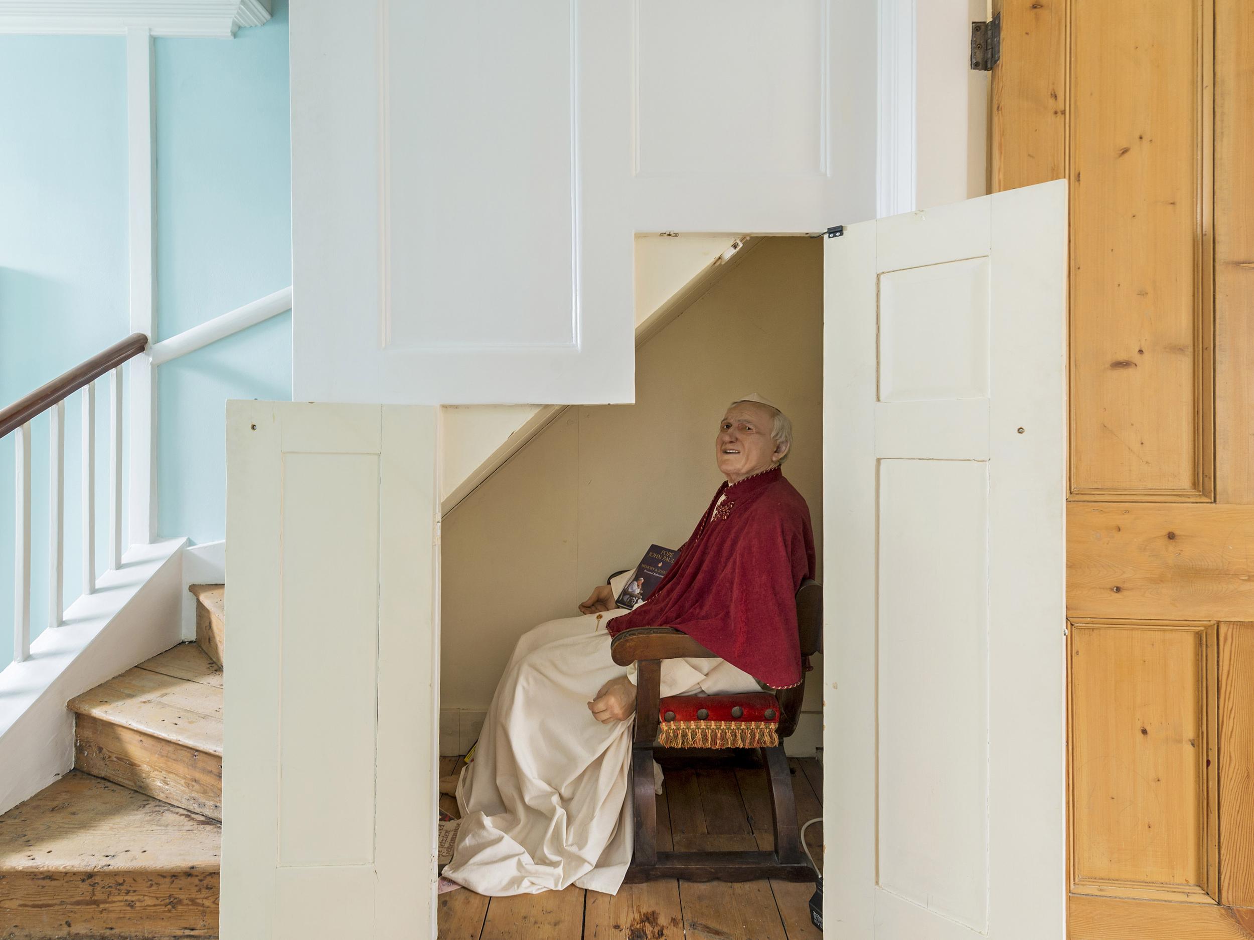 A life-size wax figure of Pope Jean Paul II can be found under the stairs (Kinleigh, Folkard & Hayward)