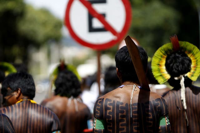 Members of the Indigenous Kayapo people hold a protest against the construction of the BR-163 highway in Brasilia, Brazil